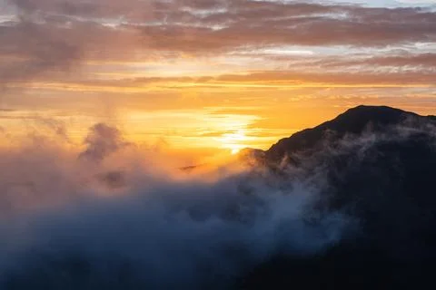 Sunrise Over Cloudy Mountain Ridge Stock Photos