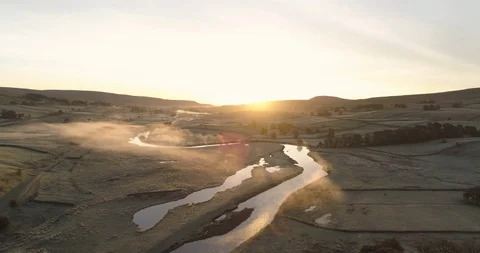 Sunrise over a curved river Stock Footage 119840439