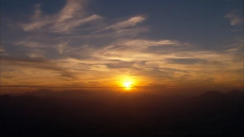 Sunrise over distant mountains, Sun At Dawn Stock Footage 108573213