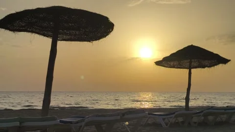 Sunrise Over Djerba Beach with Beach Umbrellas Stock-Footage 342786341
