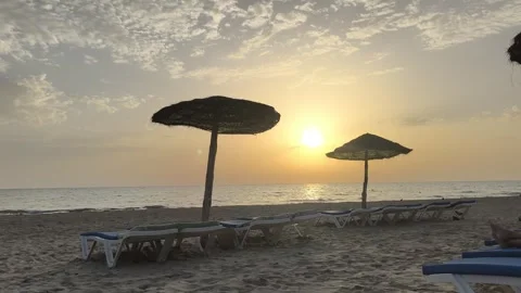 Sunrise Over Djerba Beach with Beach Umbrellas Video stock 342786344