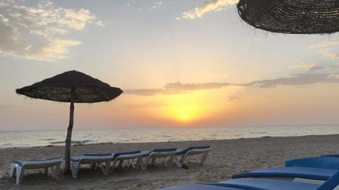Sunrise Over Djerba Beach with Beach Umbrellas Video stock 342786457