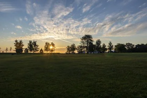 Sunrise over an empty field Foto stock