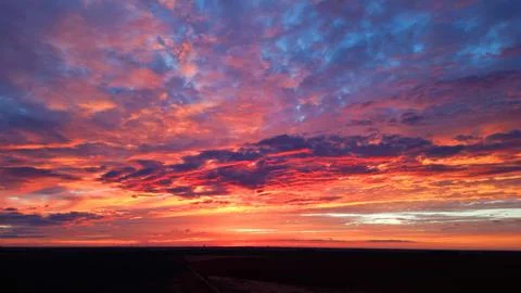 Sunrise over field Stock Photos