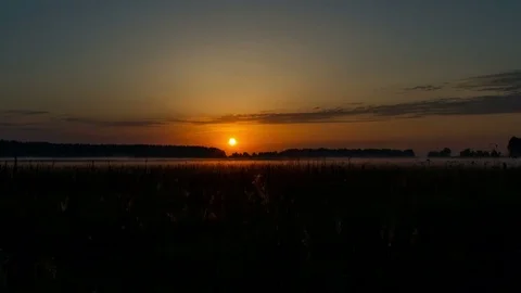 Sunrise over field time lapse Video stock 71348900