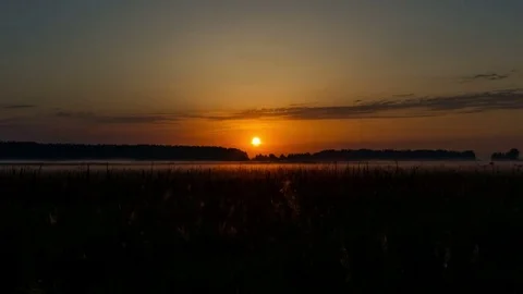 Sunrise over field time lapse Stock Footage 72927598