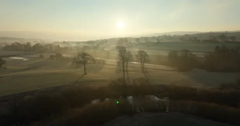 Sunrise over fields and river in north England Stock Footage 305288061