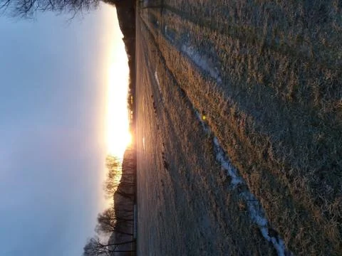 Sunrise over the fields Stock Photos