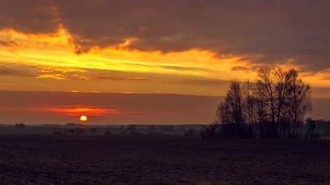 Sunrise over fields. Time lapse with closed up sun shield of sun. Stock Footage 154901495