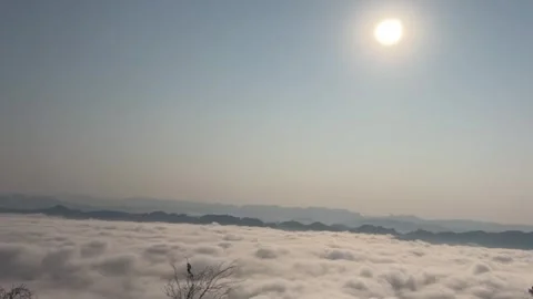 Sunrise Over Flowing Sea of Clouds and Mountain Silhouettes in China. Stock Footage 327765302