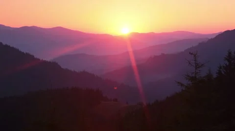 Sunrise over the Forested Mountains and Sunrays. Time Lapse Stock Footage 53747548