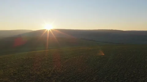 Sunrise over gently rolling agricultural fields in the countryside of Nievre Stock Footage 346719833