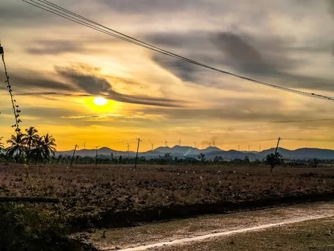Sunrise Over Harvest Fields: Explore the majestic beauty of a dramatic sunrise Stock Photos