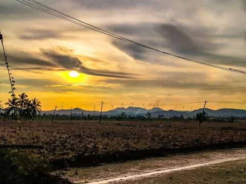 Sunrise Over Harvest Fields: Explore the majestic beauty of a dramatic sunrise Stock Photos