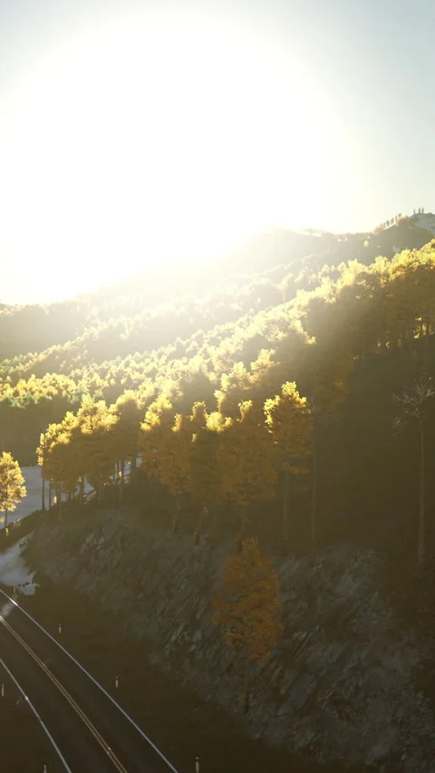 Sunrise over hills with trees and railway tracks in the foreground Stock Footage 339508137