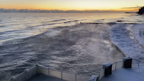Sunrise Over an Icy Lake Michigan Beach Stock Footage 168137553