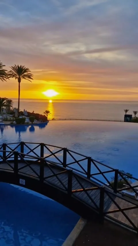 Sunrise Over Infinity Pool and Ocean at Luxury Fuerteventura Resort 4K Stock Footage 329121964