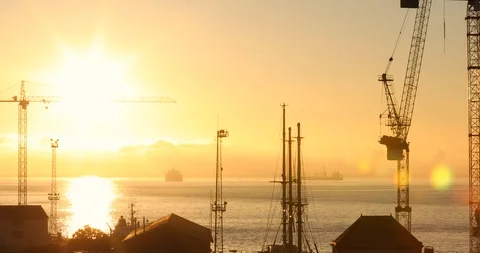 Sunrise over Lisbon Harbor and Tagus River. Harbor Crane Structures Stock Footage 104561353
