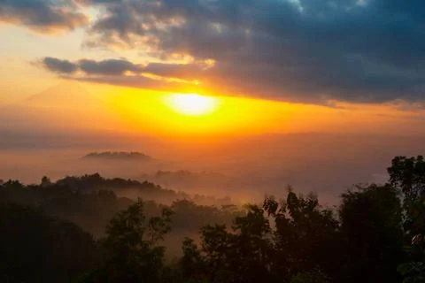 Sunrise over Merapi volcano and Borobudur temple, Indonesia Colorful sunri... Stock-Fotos