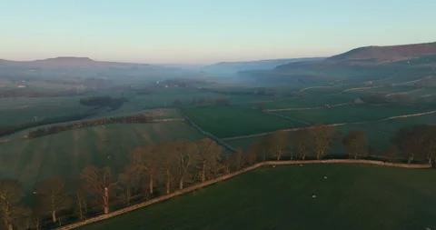 Sunrise over misty fields in north Yorkshire Stock Footage 307593611