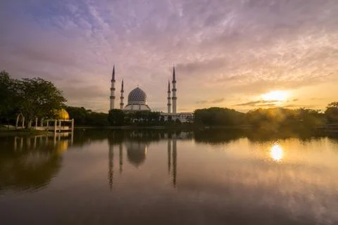 Sunrise over the mosque. Stock Photos