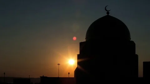Sunrise over the mosque timelapse Stockbeeldmateriaal 83428091