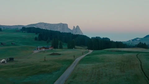 Sunrise over the Mountain Landscape with a Winding Road Through Green Hills 库存影片 331168720
