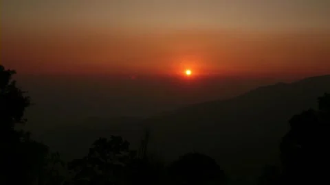 Sunrise Over Mountain Range with Silhouetted Trees Stock Footage 327269219