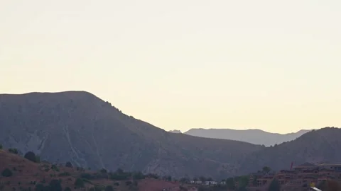 Sunrise over mountain silhouette with cable car station panning footage Stock-Footage 345313384