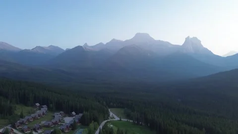 Sunrise Over a Mountain Town in a Forest Valley Stock Footage 318818062
