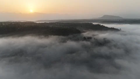 Sunrise over mountains with clouds in foreground  - 2 Stock Photos