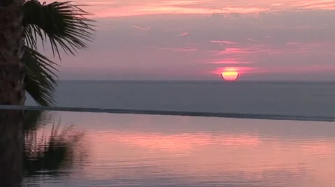 Sunrise Over Ocean and Infinity Edge Pool Stock-Footage 1012708