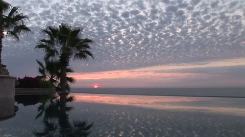 Sunrise Over Ocean and Infinity Edge Pool With Clouds Stock-Footage 1012765