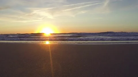 Sunrise Over Ocean and Rays on the Beach Stock Footage 58784341