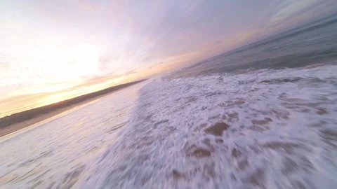 Sunrise over ocean waves with gentle surf Stock Footage 344542601