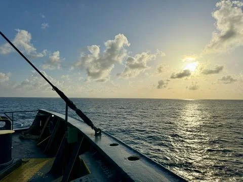 Sunrise Over Open Ocean Viewed from Container Ship Bow Stock Photos