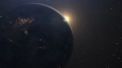 Sunrise over plant earth. Rotating earth in outer space during sunrise. 4K & 3D. Stock Footage
