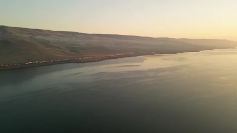 Sunrise over the river and freight rain Stock Footage 248002362