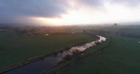 Sunrise over a river bend Stock Footage 104876361