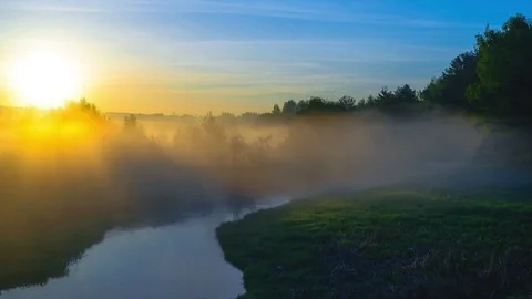 Sunrise over the river with clouds Stock Footage 76041800