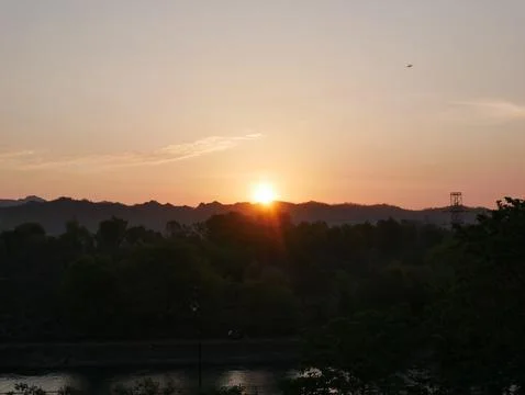 Sunrise Over River Dense Vegetation Stock Photos