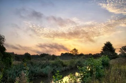 Sunrise over the river Stock Photos