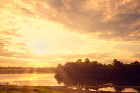 Sunrise over the river Stock Photos