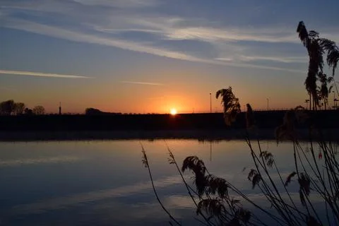Sunrise over the river Stock Photos