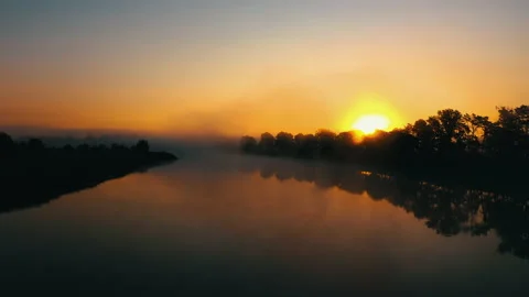 Sunrise over the river. Сlouds over the river. Stock Footage 173043086