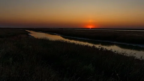 Sunrise over river in steppe time lapse Stock Footage 120805070