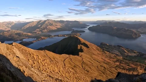 Sunrise Over Roys Peak: Panoramic View of Lake Wanaka and Southern Alps, Ne.. Stock Footage 295011877