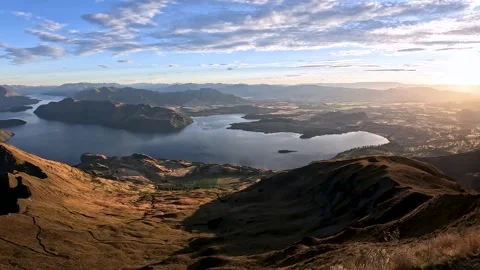 Sunrise Over Roys Peak: Panoramic View of Lake Wanaka and Southern Alps, Ne.. Stock Footage 295011884