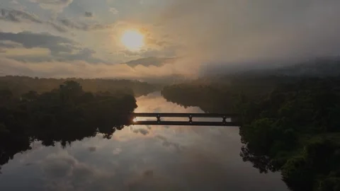 Sunrise over Savitri River backwaters near Poladpur, Maharashtra, India Stock Footage 320555503