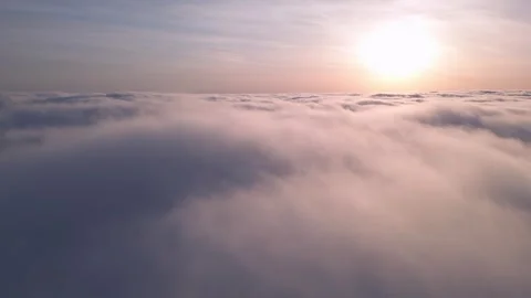 Sunrise Over a Sea of Clouds Captured by Drone Stock Footage 266413771